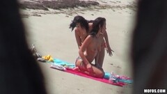 Brunette babes give head and fuck on the beach Thumb