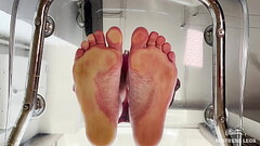Squeezing juice from cherry tomatoes with my bare feet POV Thumb