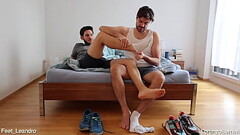 Gay friends playing with feet, socks and shoes Thumb