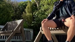 Cock exposing on outdoor bench Thumb